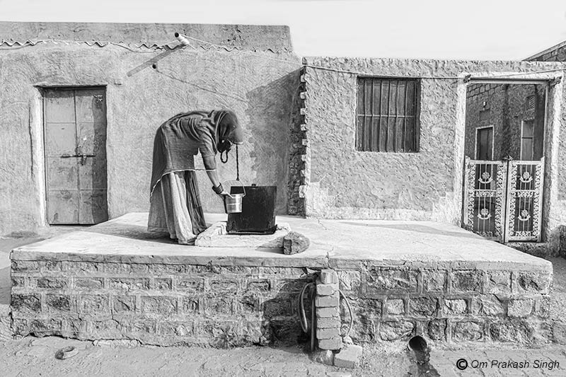 Water from Viprasar pond stored in a household tank called ‘tanka’ being conveniently withdrawn as drinking water in Netsi village, Thar Desert, Jaisalmer, Rajasthan, India